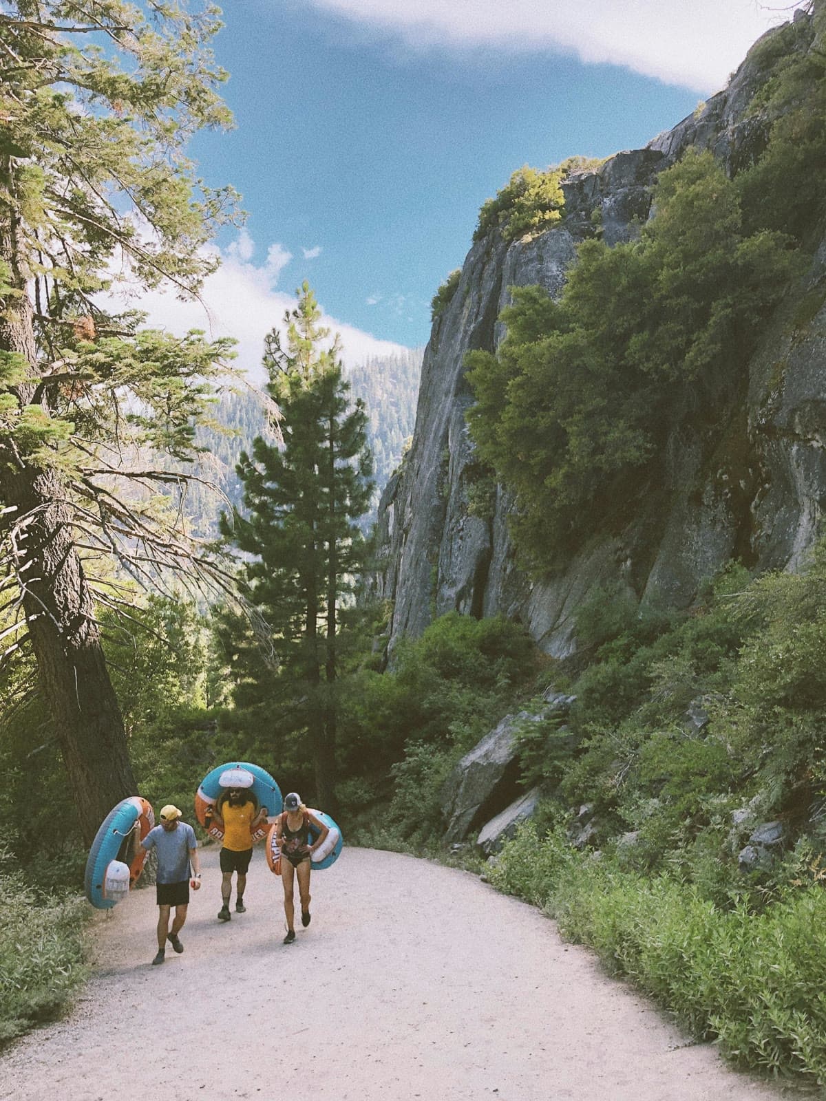 Team members hiking a mountain trail during an alpine company offsite adventure.