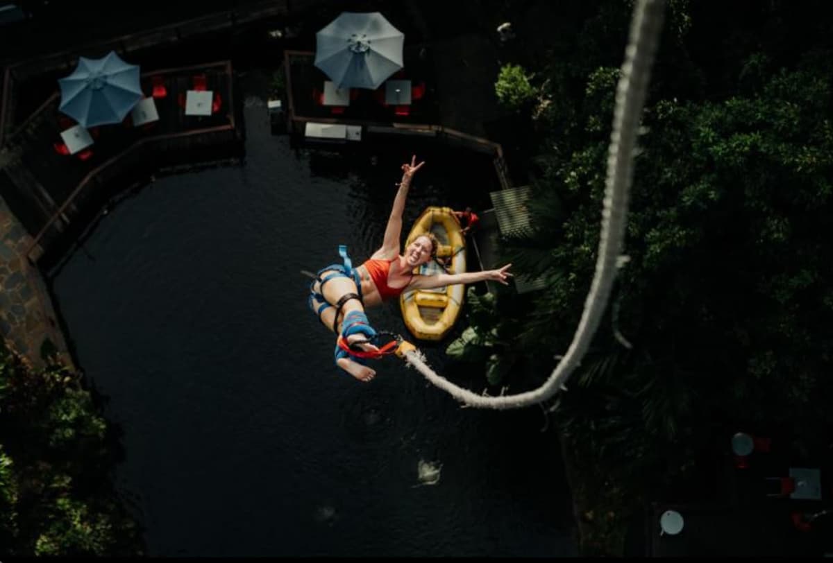 Lara Lain bungy jumping at A.J. Hackett in Cairns, Australia, capturing the adventurous spirit of the workation lifestyle.