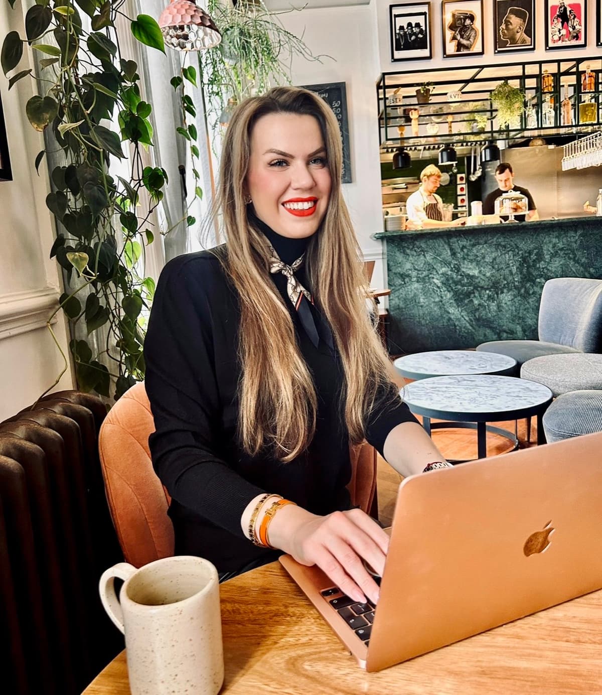 Nadia Harris working from a cafe with a laptop, demonstrating the flexible workplace and the future of work.