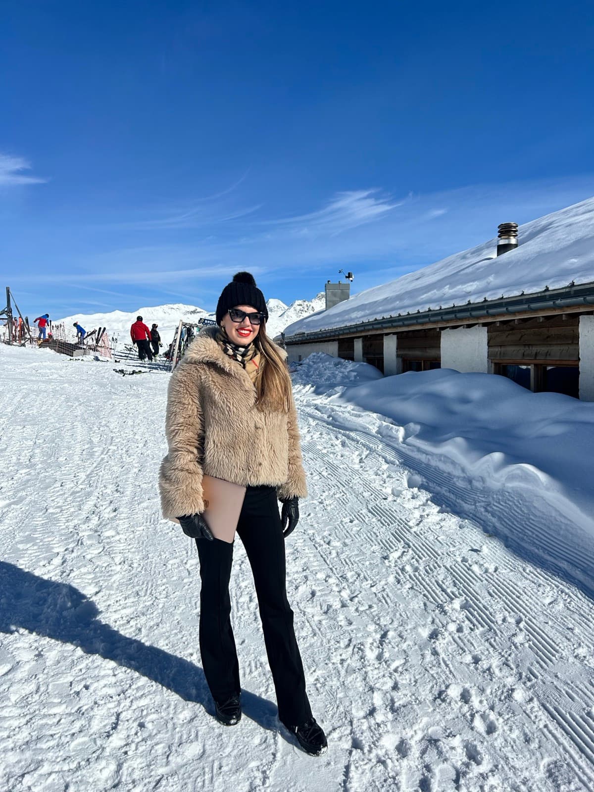 Nadia Harris enjoying a workation in the Swiss Alps in Switzerland, demonstrating a location-flexible remote work lifestyle.