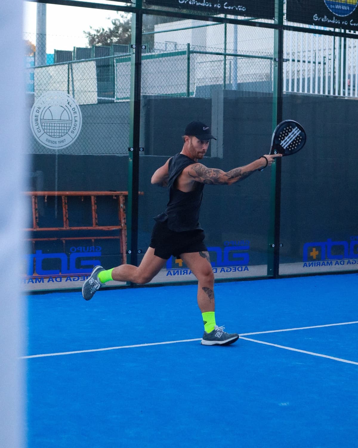 Digital nomad playing padel in Portugal, an active lifestyle and sports during a workation.
