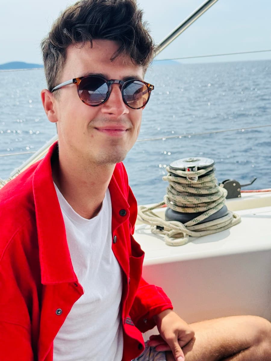 Mark Haver soaking in ocean views on a sailboat on the Adriatic Sea in Croatia, ocean sustainability consultant and digital nomad.