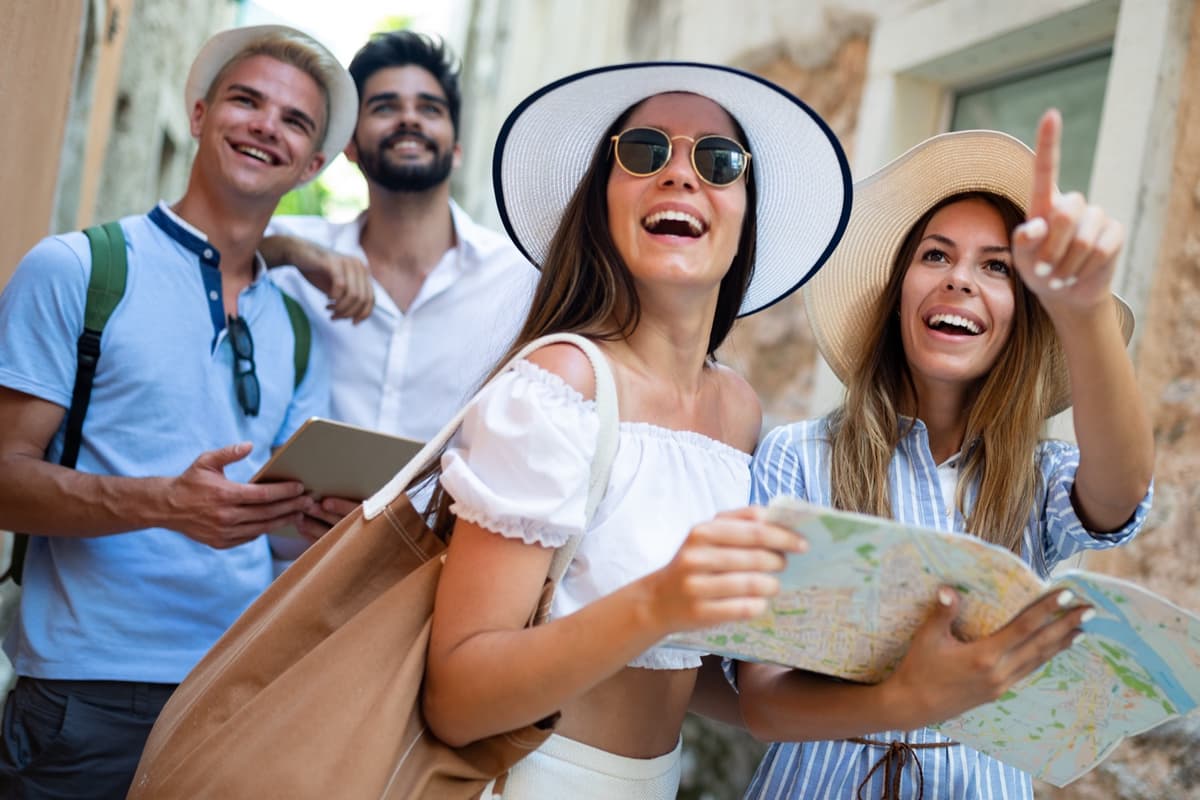 Remote team enjoying a city tour and cultural exploration during a company workation retreat.
