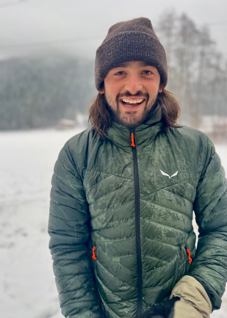 Martijn Smeets in the snowy Austrian Alps in winter, living the remote work lifestyle as founder of The Thrive Tribe.