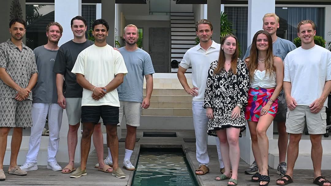 Staffinghouse team standing at a luxury villa pool during their two-week company workation in Bali, Indonesia.