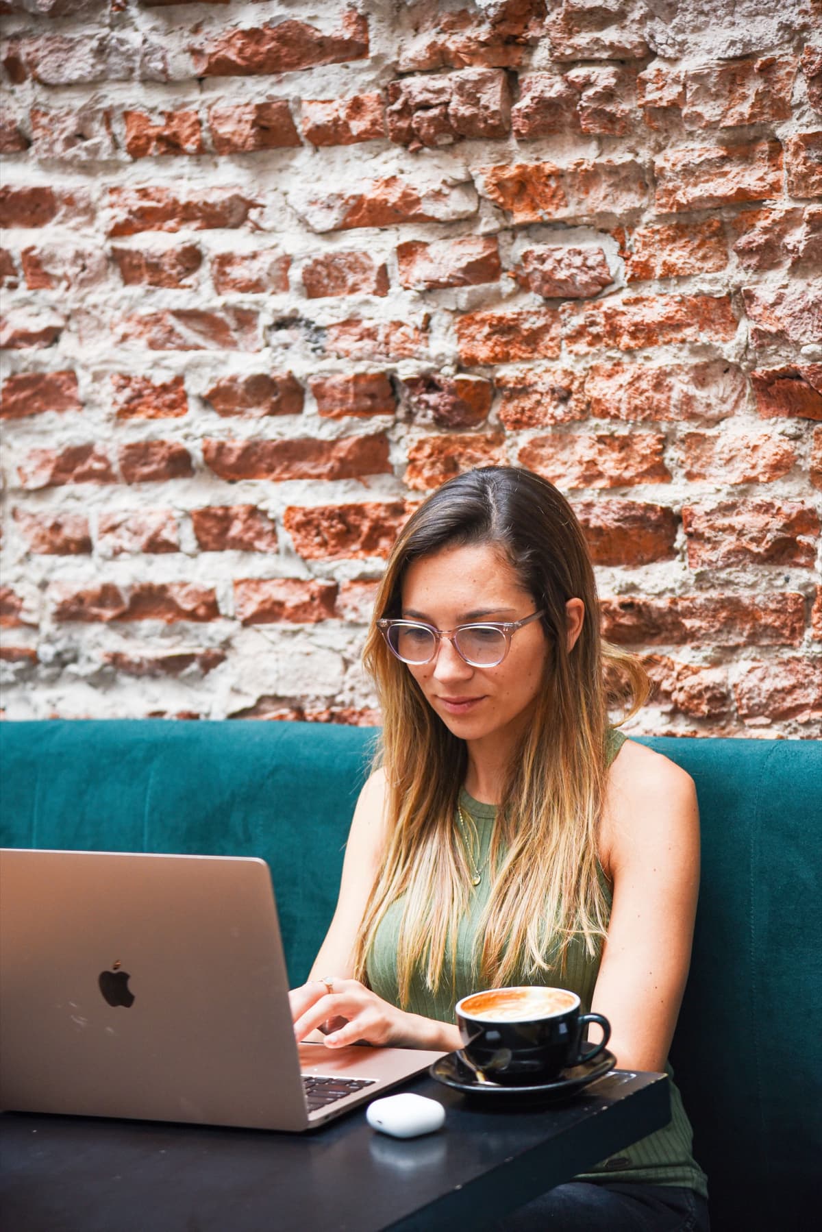 Kristin Vierra working remotely from a cafe in Buenos Aires, digital nomad coworking lifestyle.