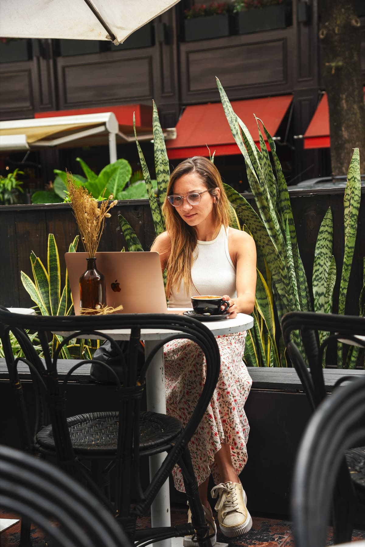 Kristin Vierra working from an outdoor terrace in Buenos Aires, Argentina.