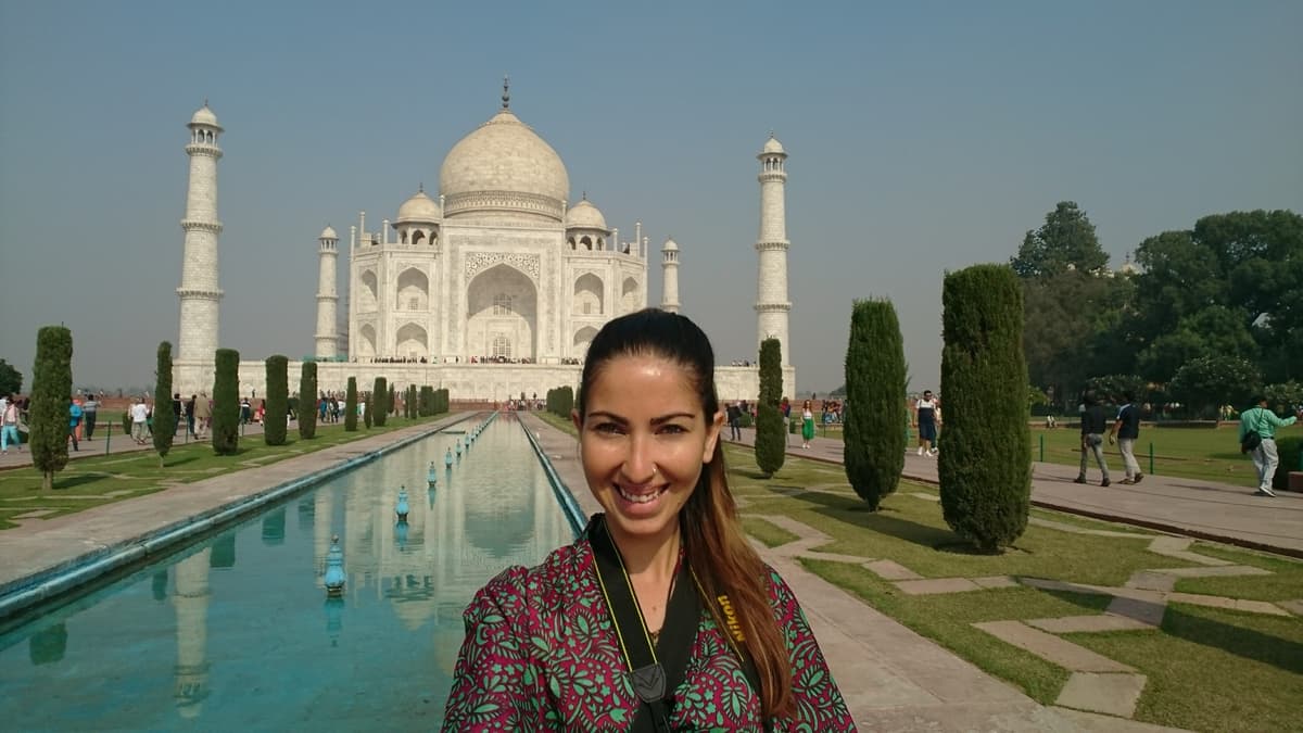 Communication strategist Alexia de Souza at the Taj Mahal in India during international career travels.