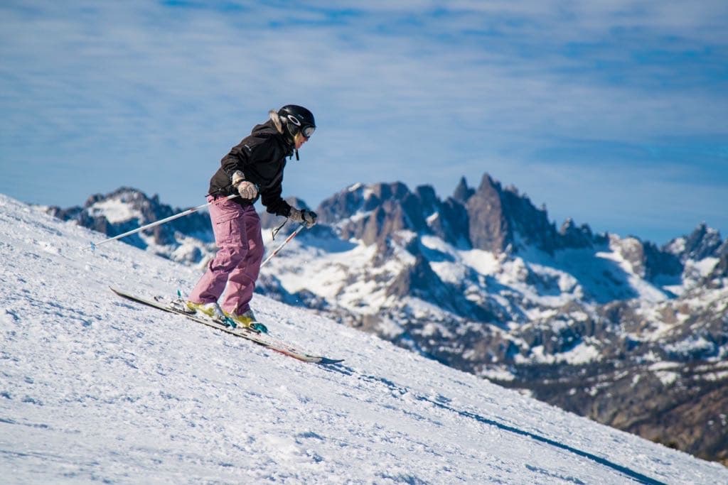 Workplace wellbeing expert Sally Clarke skiing in the Alps, leadership resilience and stress management through adventure