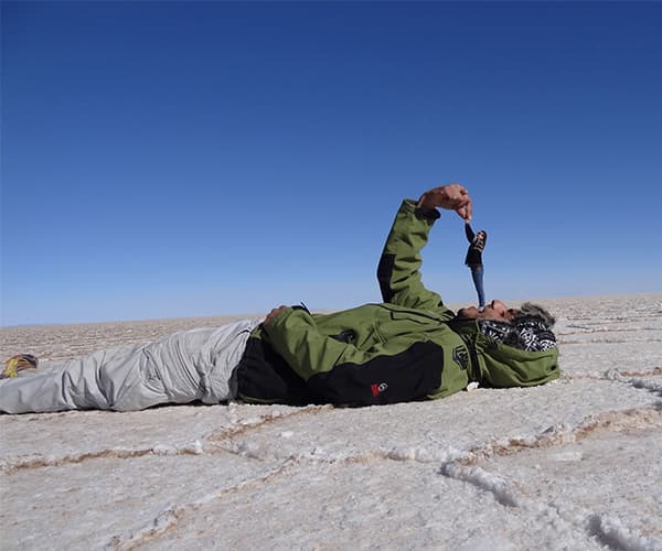 A forced-perspective shot on the Salar de Uyuni salt flats, bucket-list day of a company offsite