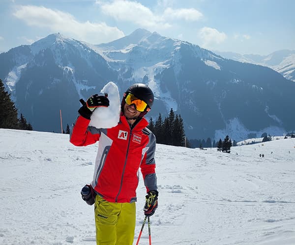 A skier catching their breath on an Austrian Alps piste, mountain-air company offsite