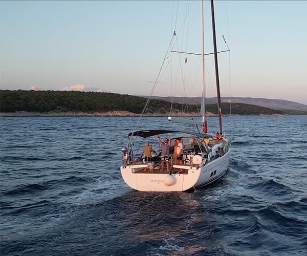 Team sailing yacht on Adriatic Sea during company offsite retreat in Croatia