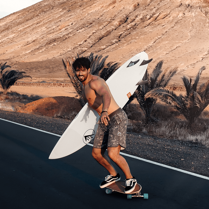 Heading to the water with a board on Gran Canaria, surf session on a marketing team retreat