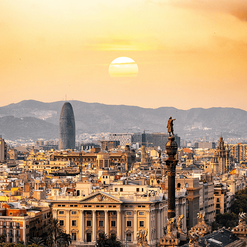 Barcelona's skyline at sunset, the city that hosts a creative innovation company offsite