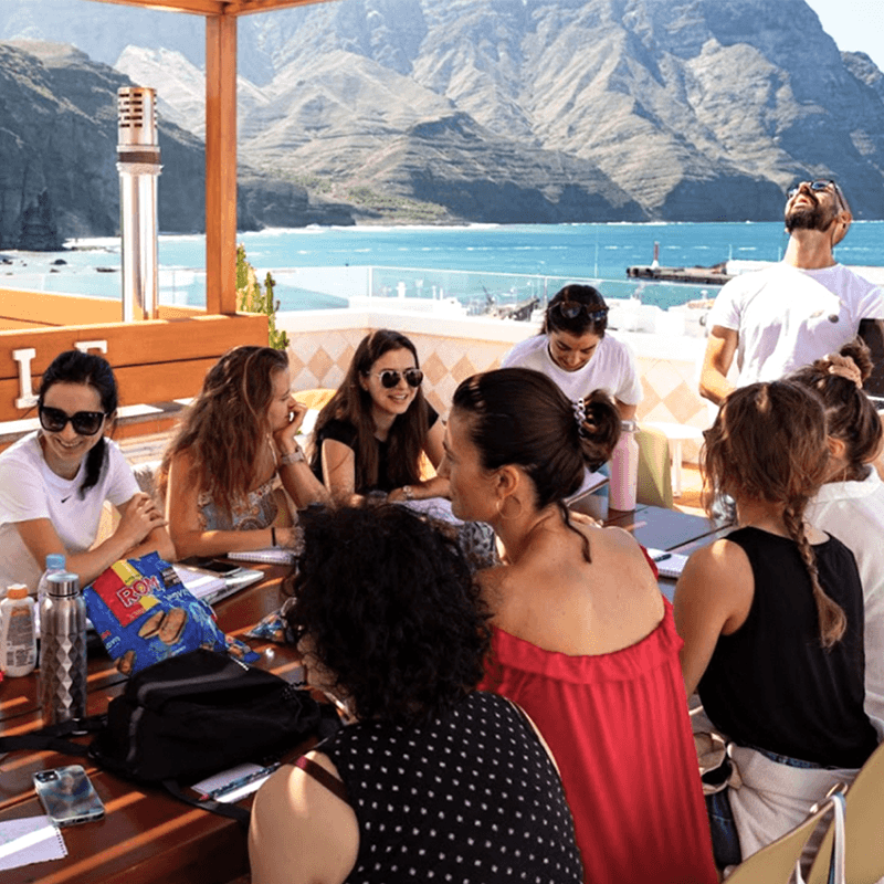 Marketing communications team breakout session in Gran Canaria with ocean mountain views