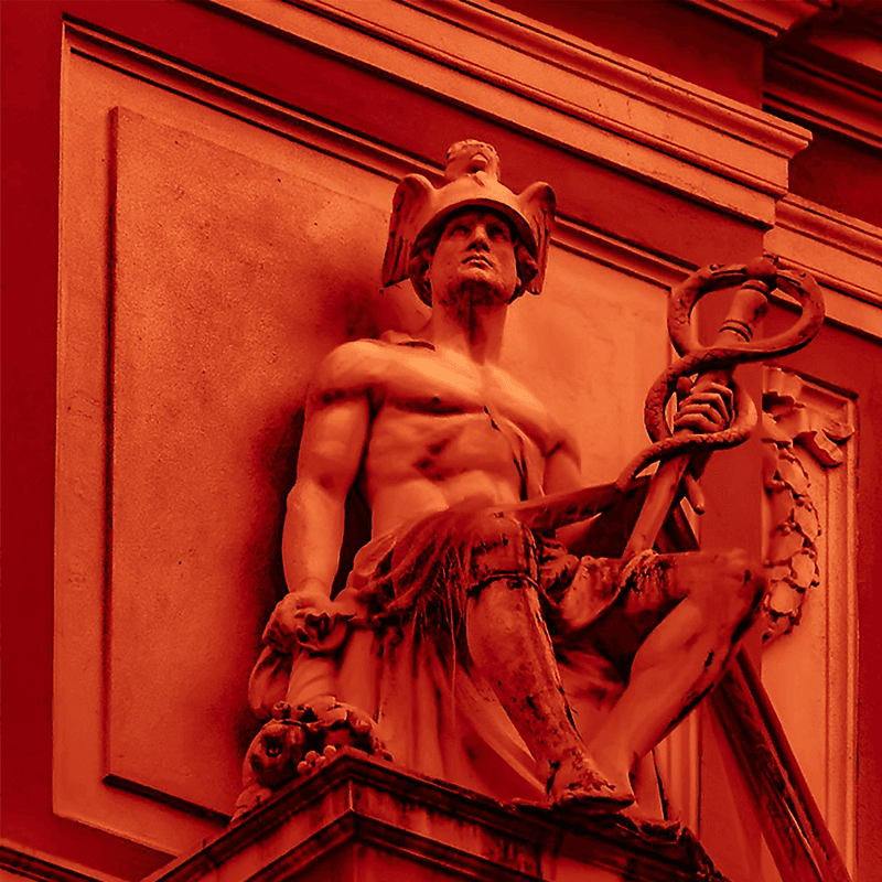 Mercury, god of communication, carved in red stone, the messaging motif of a PR team retreat