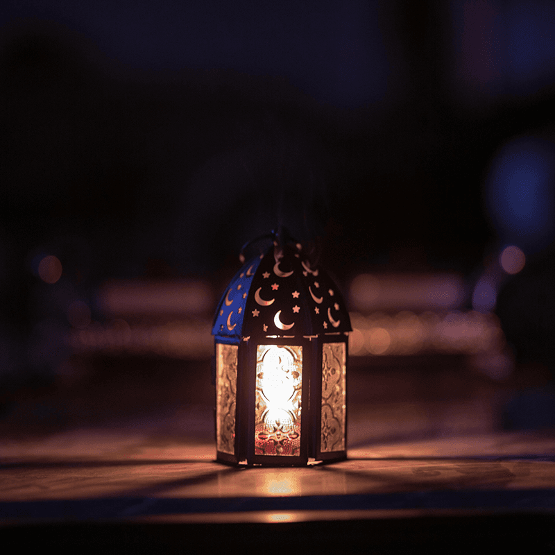A Moroccan lantern lit in the dark, the storytelling image behind a PR team retreat