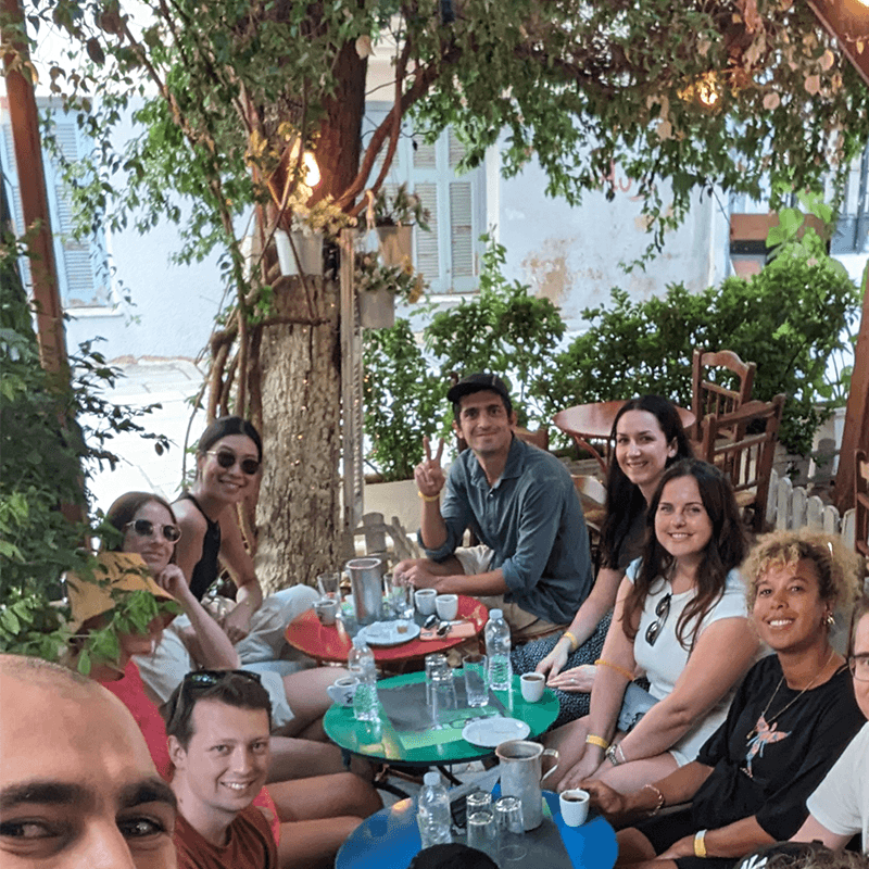 A remote team around an outdoor dinner table, the evening of a culture team retreat