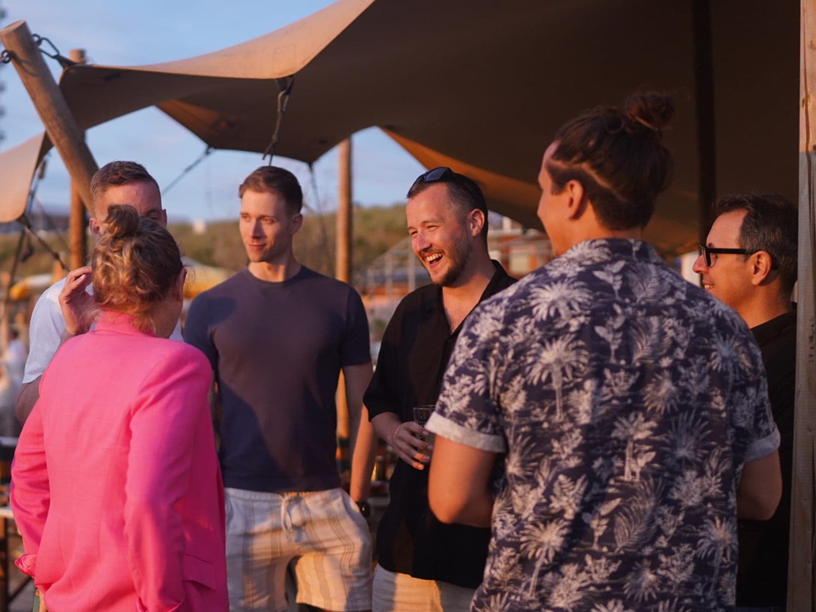 Startup team building connections at sunset retreat